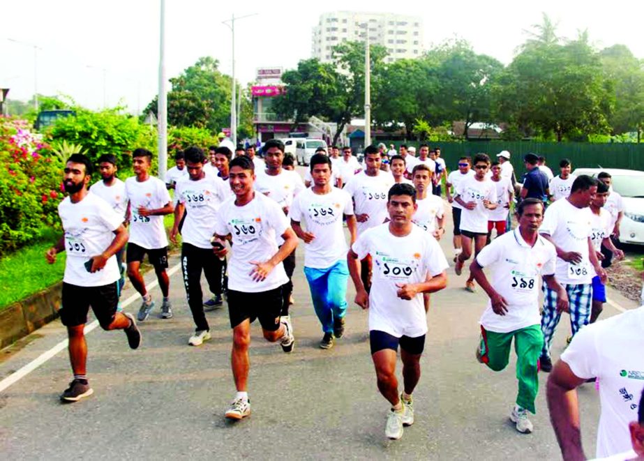 The participants of the Independence Day marathon in action in the city street on Friday.