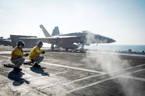 A F/A-18E Super Hornet launches from the flight deck of the Nimitz-class aircraft carrier USS Carl Vinson.