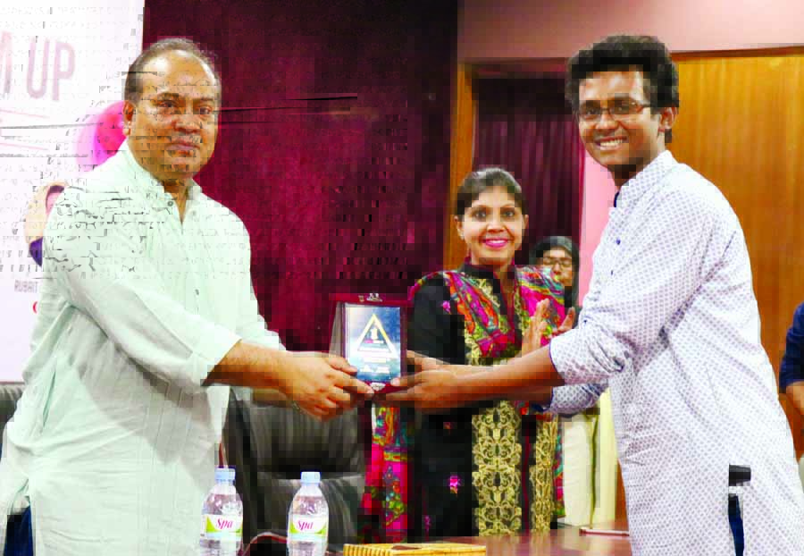Dean of Business Faculty of Dhaka University Prof Shibli Rubayat-ul-Islam handing over crest to a participant at a Career Development Programme at its seminar room on Saturday.