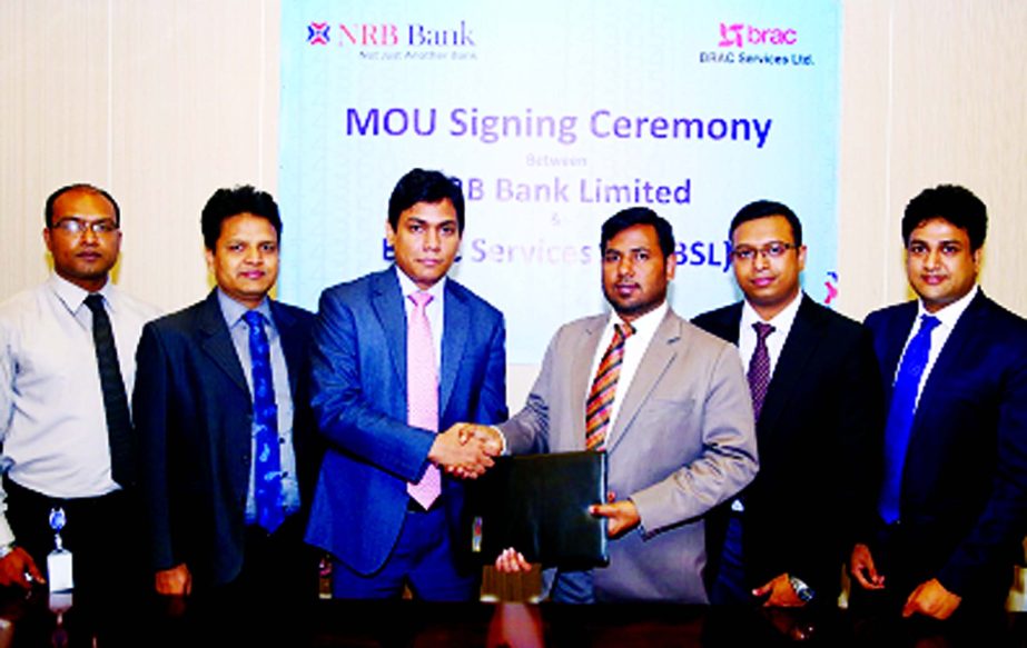 Mir Shafiqul Islam, Head of Cards of NRB Bank Limited and MZI Dalton Zahir, Head of Sales & Marketing of BRAC Services Ltd exchanging documents after signing an agreement in the city recently. Under the deal, all NRB Bank cardholders will be privileged wi