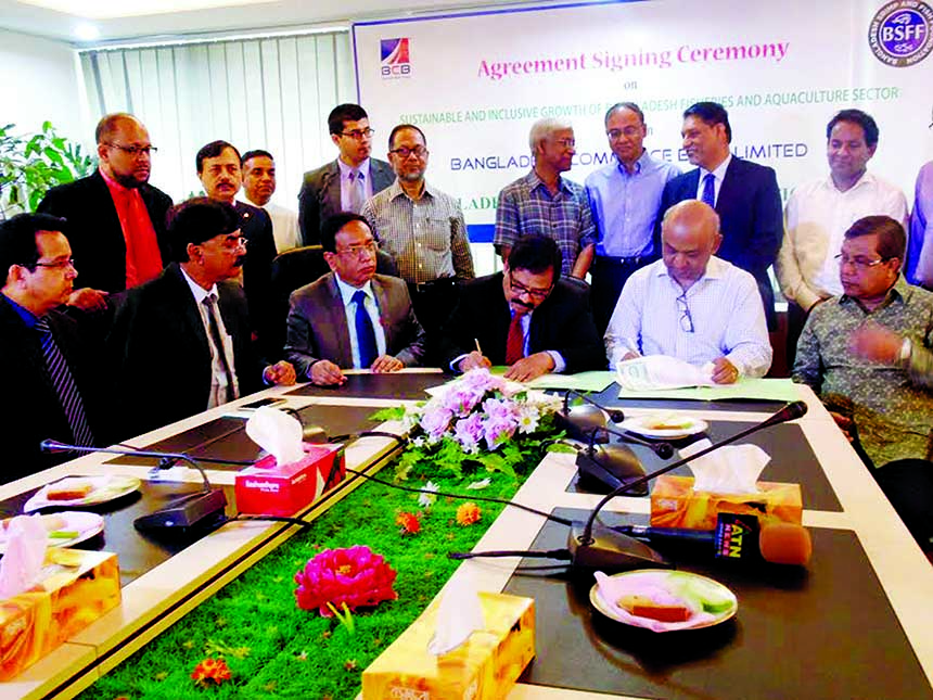Syed Mahmudul Huq, Chairman, Bangladesh Shrimp and Fish Foundation and RQM Forkan, Managing Director of Bangladesh Commerce Bank Ltd signing a MoU at the bank head office in the city recently. Engineer Rashid A Chowdhury, Chairman, of the bank and Syed Ar