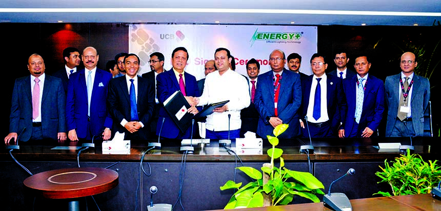 Muhammed Ali, Managing Director of United Commercial Bank Limited and Md Shah Jobaer, Managing Director of Energy Plus Electric & Electronics (Pvt.) Ltd exchange documents after signing a MoU at the bank head office on Monday. M Shahidul Islam, Mirza Mahm