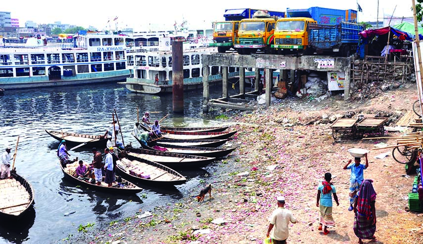 River encroachers are very active in grabbing the land of Buriganga river though the eviction drive is going on. The snap was taken from the city's Badamtali ghat on Sunday.