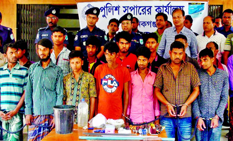 Manikganj police detained about 23 persons from different areas and seized some arms, cocktails and bombs from their possession. This photo was taken from the office of Manikganj Police Super on Tuesday.