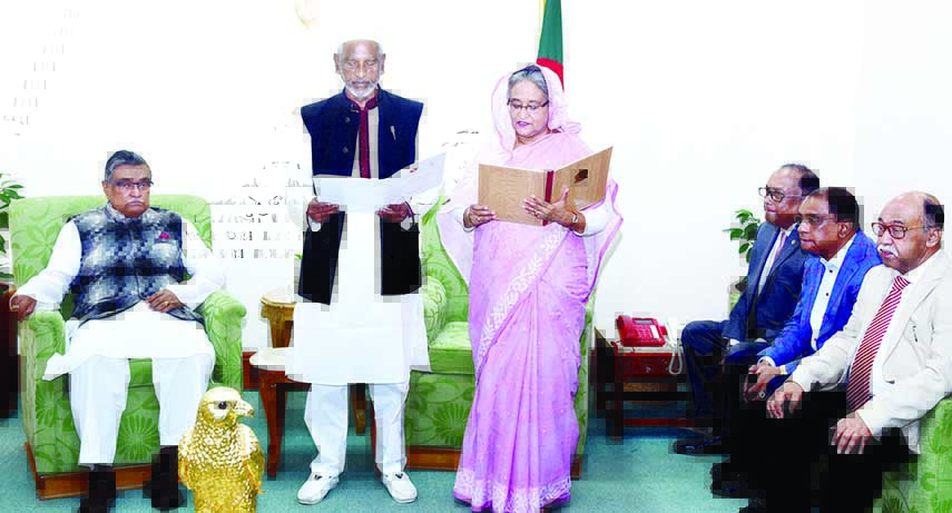 Prime Minister Sheikh Hasina administering oath to the newly-elected Narsingdi Zila Parishad Chairman at her office yesterday.