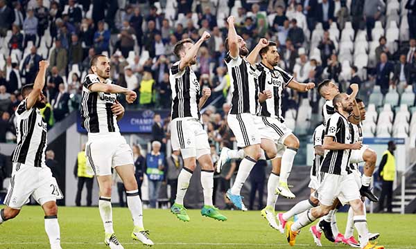 Juventus players celebrate their 3-0 win, at the end of a Champions League, quarterfinal, first-leg soccer match between Juventus and Barcelona, at the Juventus Stadium in Turin, Italy, Tuesday. Juventus won 3-0.