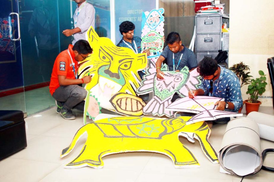 Students of Multimedia and Creative Technology Department of DIU are seen busy with making paper made animals and traditional dolls which will be a part of the colorful procession Mangal Shobhajatra to be brought out hailing the first day of Bangla New Ye
