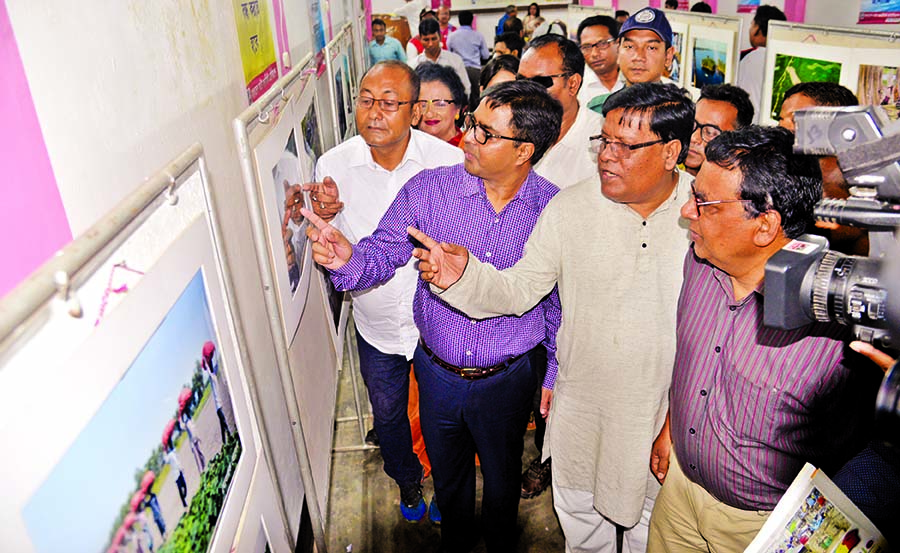 Dhaka South City Corporation Mayor Alhaj Sayeed Khokon visiting the photo exhibition organised by Bangladesh Photo Journalists Association office at Purana Palton in the city yesterday.