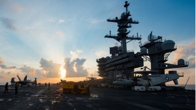 Getty Images Image caption The US carrier group deploying off the Korean peninsula is led by the USS Carl Vinson