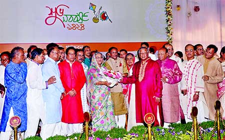 Prime Minister Sheikh Hasina receiving bouquet from Awami League leaders on the occasion of Pahela Baishakh at Gonobhaban on Friday.