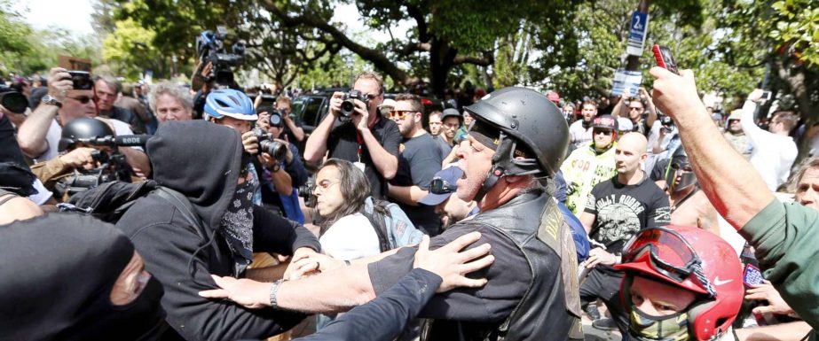 Anti and pro-Donald Trump supporters clash during competing demonstrations at Martin Luther King Jr. Civic Center Park in Berkeley, Calif. on Saturday