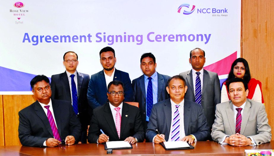 Mosleh Uddin Ahmed, Additional Managing Director of NCC Bank Ltd. and Saif Dali, Head of Sales & Marketing of Rose View Hotel, Sylhet signing an agreement recently. Under the deal, bank's Credit Cardholders will get 50 percent discount on different servi