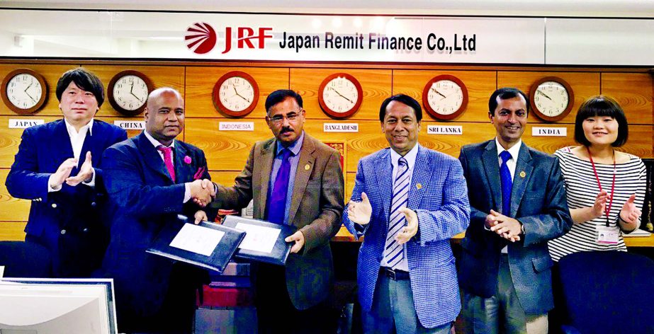 Md. Ataur Rahman Prodhan, Managing Director of Rupali Bank Limited and Sarwar Sunny Hossain, President of Japan Remit Finance Co., Ltd (JRF), exchanging signing documents for Remittance Drawing Arrangement at JRF head office in Tokyo, Japan recently. Monz