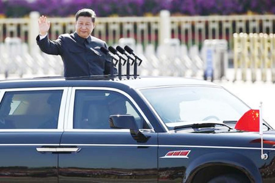 Chinese President Xi Jinping waves as he reviews the army, at the beginning of the military parade marking the 70th anniversary of the end of World War Two in Beijing.