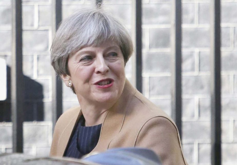 Britain's Prime Minister Theresa May arrives in Downing Street, in central London, Britain on Wednesday.