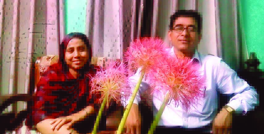 May-flower has bloomed on Wednesday at the city residence of Engineer Enamul Haque Khan, General Secretary of Dakshin Muradnagar Kalyan Samity, Dhaka. Razia Sultana, wife of Enamul also seen with him in the picture.