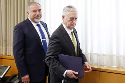 Israeli Defense Minister Avigdor Lieberman, left, and US Defense Secretary Jim Mattis takes seats for a meeting at the Defense Ministry in Tel Aviv, Israel on Friday.