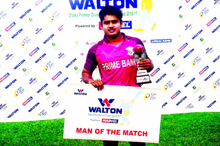 Al-Amin (Junior) of Prime Bank CC poses with the Man of the Match award at the Khan Shaheb Osman Ali Stadium in Fatullah on Friday.