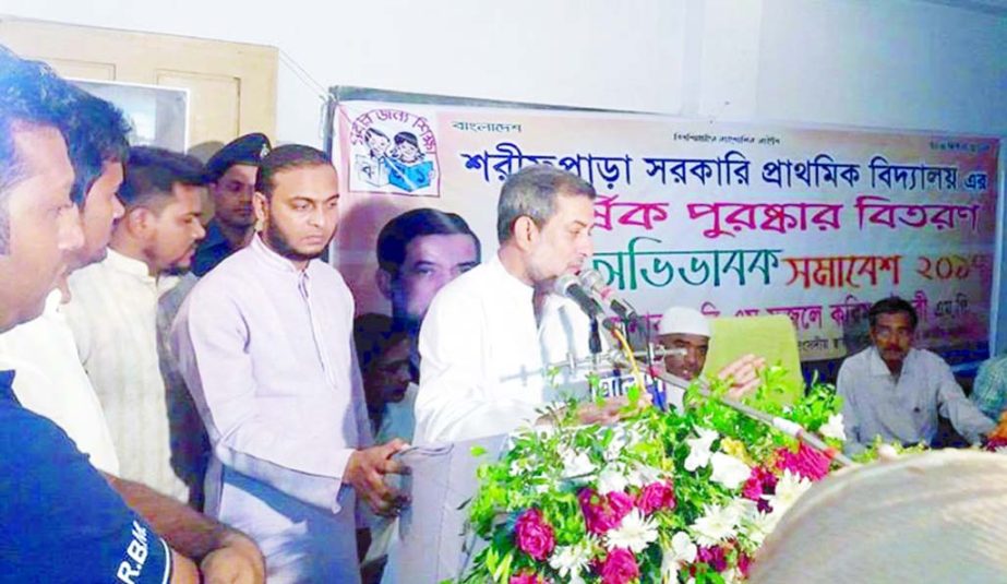 Chairman of the Parliamentary Standing Committee on Ministry of Railway ABM Fazle Karim Chowdhury addressing the annual prize distribution ceremony and guardians rally at Sharif Para Govt Pry School of Raozan on Friday as chief guest.