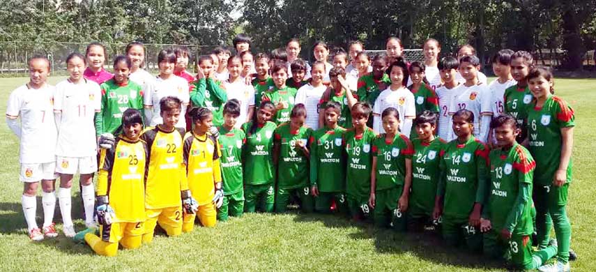 Members of Bangladesh Under-16 National Women's Football team pose for a photo session before taking part their counterpart China Football Association (CFA) Under-14 National Women's Football team in an exhibition match in China on Saturday.