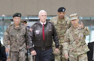 Vice President Mike Pence arrives with U.S. Gen. Vincent Brooks, (second from right), commander of the United Nations Command, U.S. Forces Korea and Combined Forces Command, and South Korean Deputy Commander of the Combined Force Command Gen. Leem Ho-youn