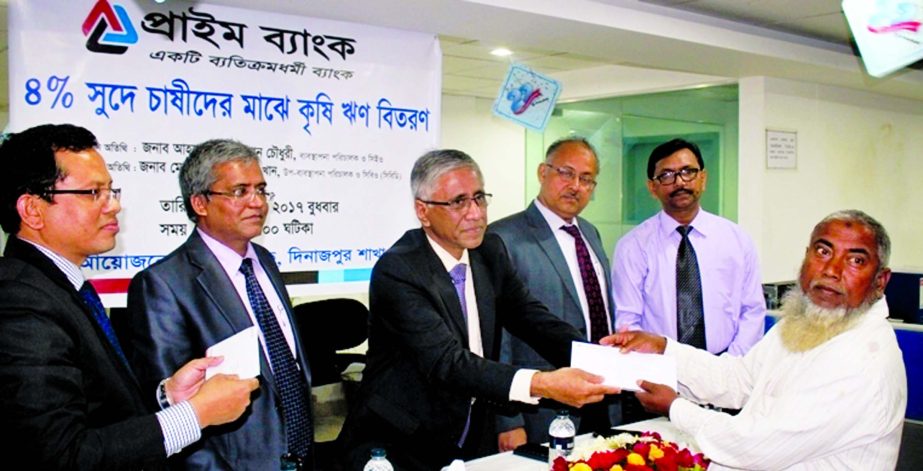 Ahmed Kamal Khan Chowdhury, Managing Director of Prime Bank Ltd, distributing Crop Loan to farmers at Dinajpur Branch recently. Md Touhidul Alam Khan, DMD, Imtiaz Ahamed Bhuiyan, EVP, AKM Enamul Haque, VP and Pijuce Kumar Roy, Head of the branch were pres