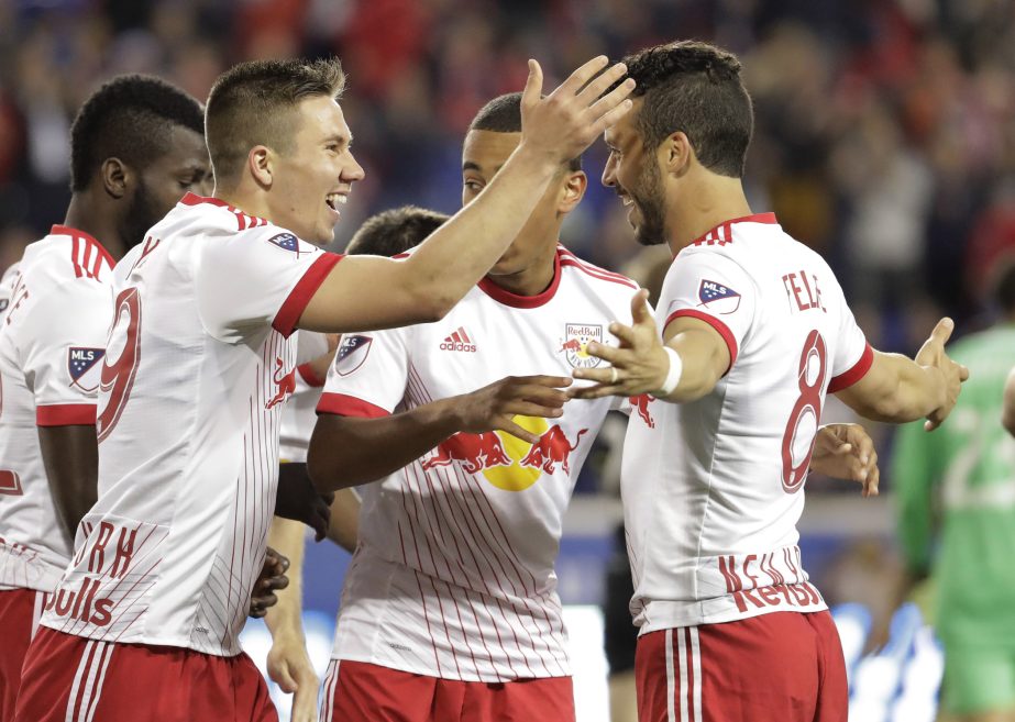 New York Red Bulls midfielder Alex Muyl (left) celebrates his goal with Felipe Martins, (right) and teammates during the first half of an MLS soccer match against Columbus Crew in Harrison, N.J on Saturday.