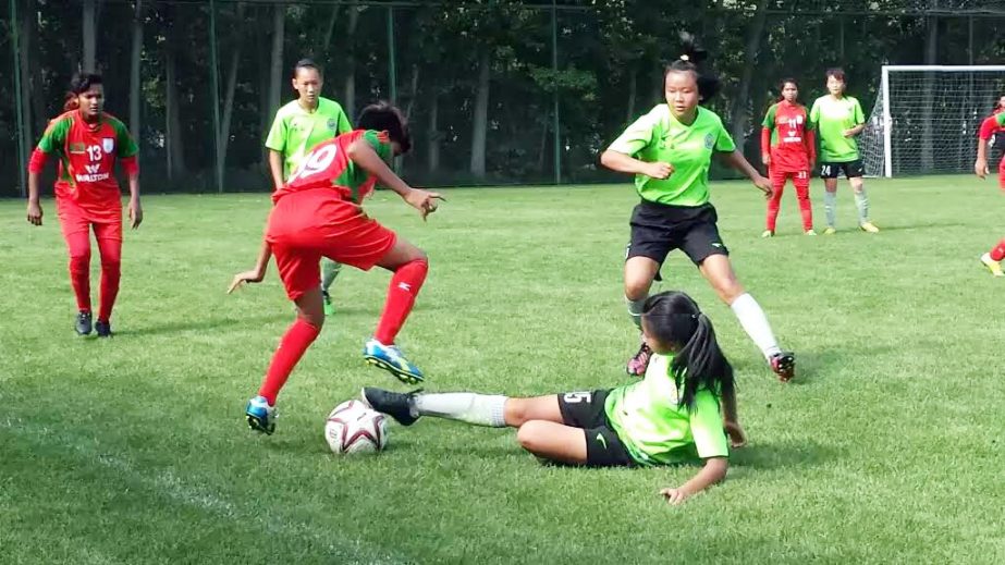 A moment of the friendly football match between Bangladesh Under-16 National Women's Football team and Shaanxi Women's Under-15 Football team at Xian City in Shanghai on Sunday.