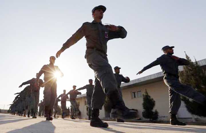 Afghan National Police (ANP) officers march at a training centre near the German Bundeswehr army camp in Kunduz, northern Afghanistan.