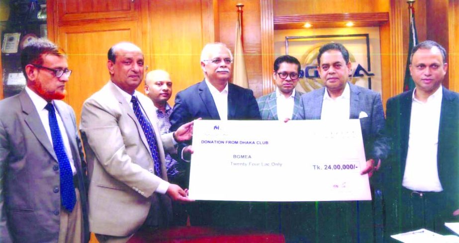 Member of the Executive Council of Dhaka Club Limited Abdus Selim handing over a cheque of Tk 24 lakh to BGMEA President Siddiqur Rahman for the assistance of Rana Plaza victims at a ceremony held in the city on Sunday.