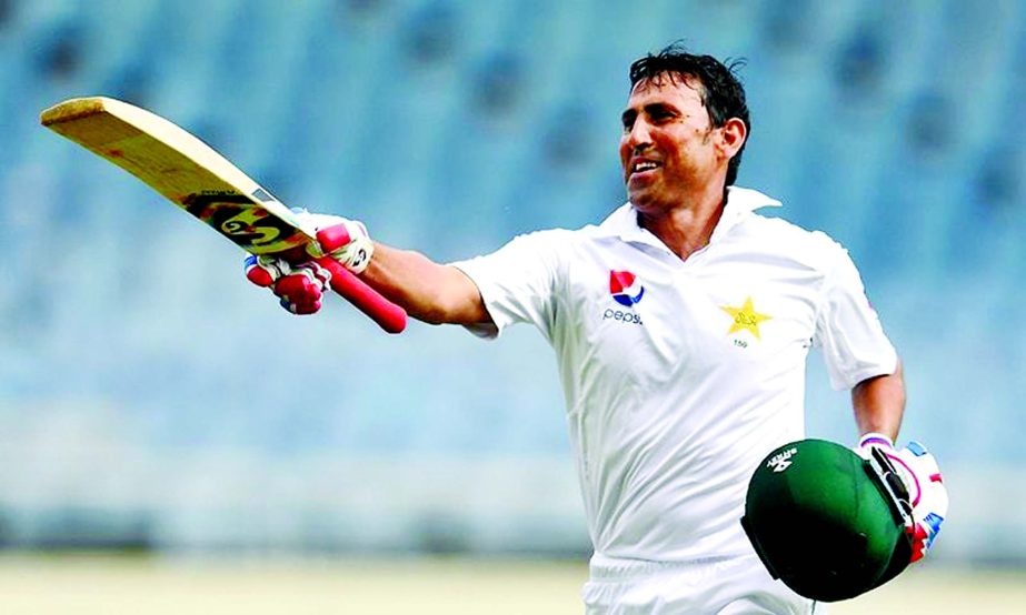 Younis Khan celebrates after reaching his 10,000th run in Test matches, on day three of the first Test match between West Indies and Pakistan at the Sabina Park in Kingston, Jamaica, on Sunday.
