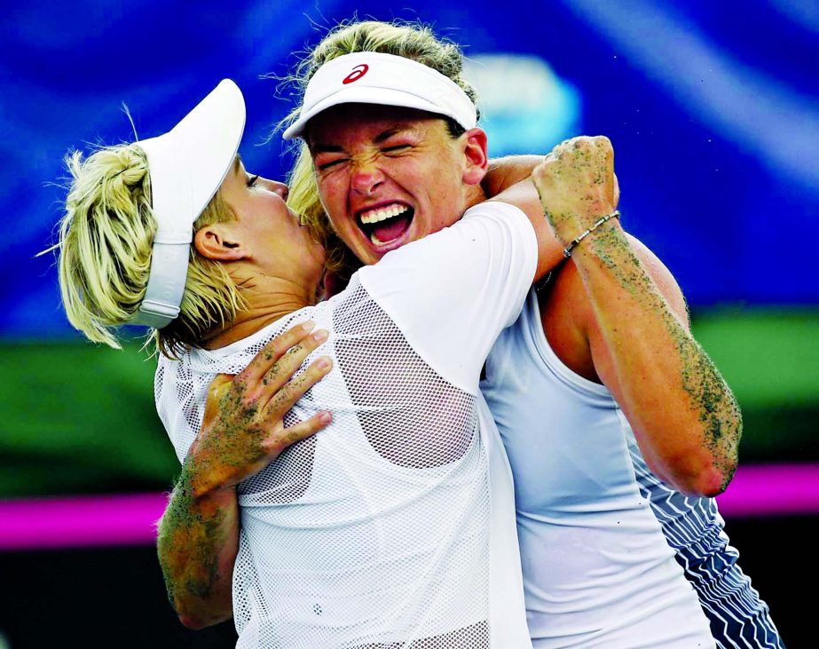 United States team players Bethanie Mattek-Sands (left) and CoCo Vandeweghe celebrate after defeating Czech Republic players Kristyna Pliskova and Katerina Siniakova during a Fed Cup semifinal doubles tennis match in Wesley Chapel, Fla on Sunday.