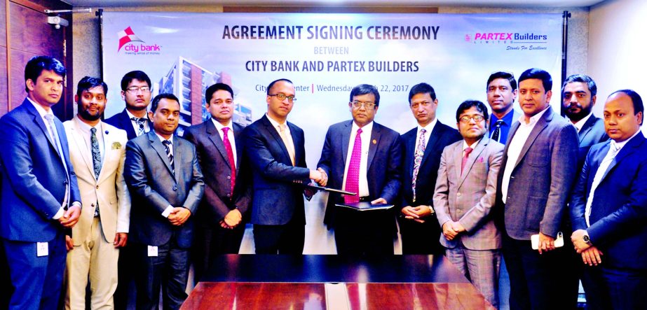 Mashrur Arefin, Additional Managing Director of City Bank Ltd and Md Munsur Ali Sikder, Chief Operating Officer of Partex Builders Limited, exchanging a signing document at the bank head office recently. According to the deal, customers who purchase their