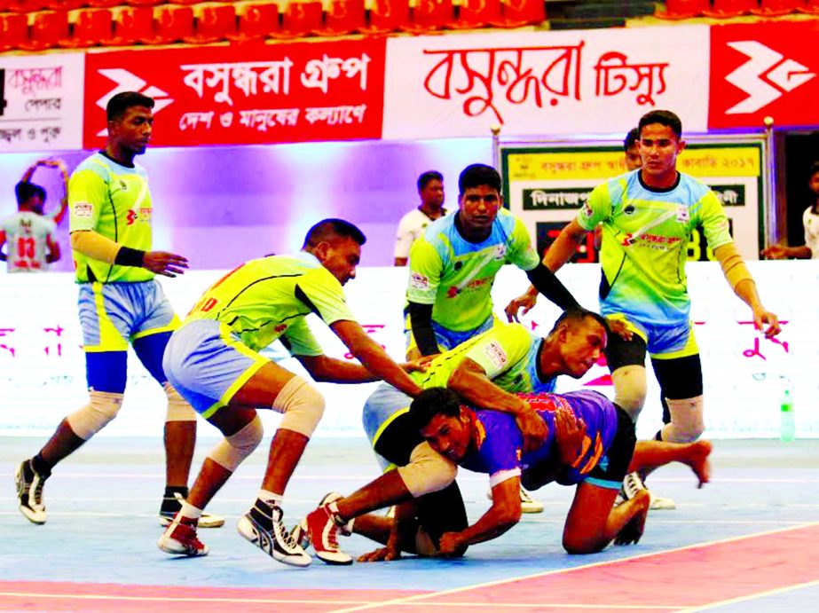 A moment of the match of the Bashundhara Presents Independence Cup Kabaddi Tournament between Bangladesh Army and Dinajpur District team at the Shaheed Suhrawardy Indoor Stadium in Mirpur on Tuesday.