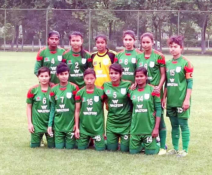 Players of Bangladesh Under-16 National Women's Football team pose for a photo session after beating China Football Association (CFA) Under-14 National Women's Football team by 3-1 goals at the Olympic Sports Village Ground in Xian, China on Wednesday.