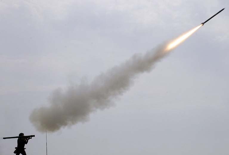 A Russian soldier fires a portable air defense rocket during the International military games "Masters of Antiaircraft Battle"" outside the Russian southern town of Yeisk.AP"