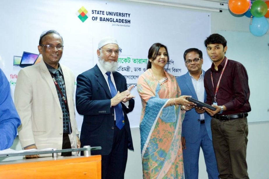 State Minister of Posts, Telecommunications and Information Technology, Advocate Tarana Halim, MP distributes laptops among the students of State University of Bangladesh on Thursday.