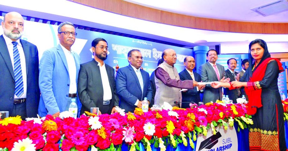 Shahjalal Islami Bank Limited awarded scholarship among the brilliant and poor students of the country. Commerce Minister Tofail Ahmed, MP, handing over a scholarship Cheque among the students at Officers Club in the city on Saturday. Engr. Md Towhidur Ra