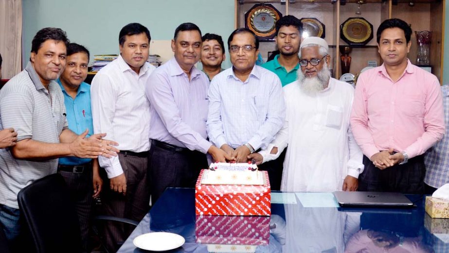 CUET VC Prof Dr Mohammad Rafiqul Alam cutting cake on the occasion of his charge handing over anniversary ceremony yesterday.