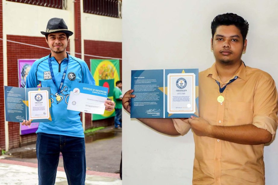 Dipta Chakraborty and S.M. Firuz Kabir, 2 Bangladeshi young cyclists and students of Daffodil International University with certificates and medals after upholding their names in Guinness Book of World Records in `Longest Single Line' category on cycling