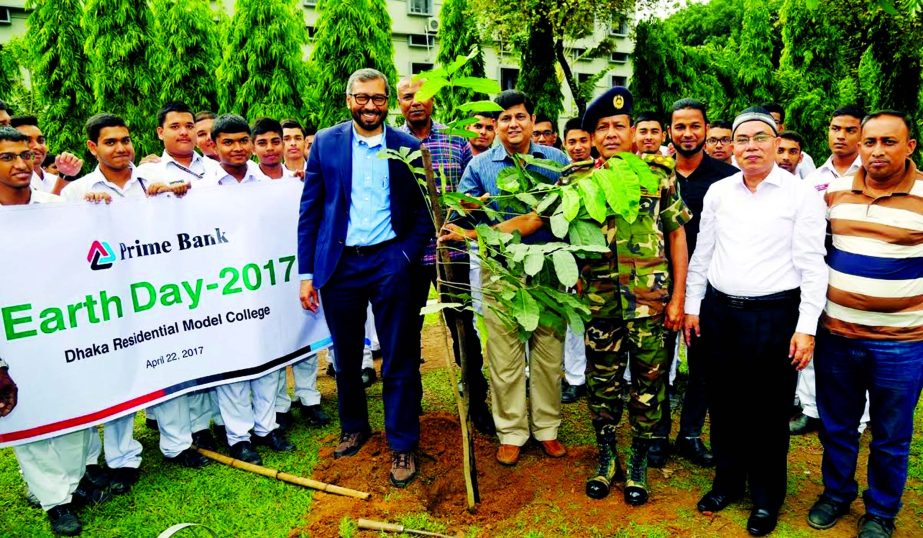 Habibur Rahman and Syed Faridul, Deputy Managing Directors of Prime Bank Ltd, planting trees at Dhaka Residential Model College premise as part of celebrated Earth Day 2017. Brigadier General Md Abdul Mannan Bhuiyan, Principal of the college and Mohd. Raf