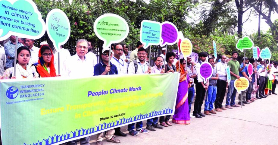 Transparency International Bangladesh formed a human chain in front of the Jatiya Press Club on Sunday demanding implementation of commitment of the developed countries for climate financing.