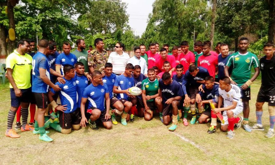 The participants of the Baishakhi Rugby Tournament with the officials and guests of Bangladesh Rugby Federation pose for a photo session at the Rugby Ground in Dhaka Cantonment on Sunday.