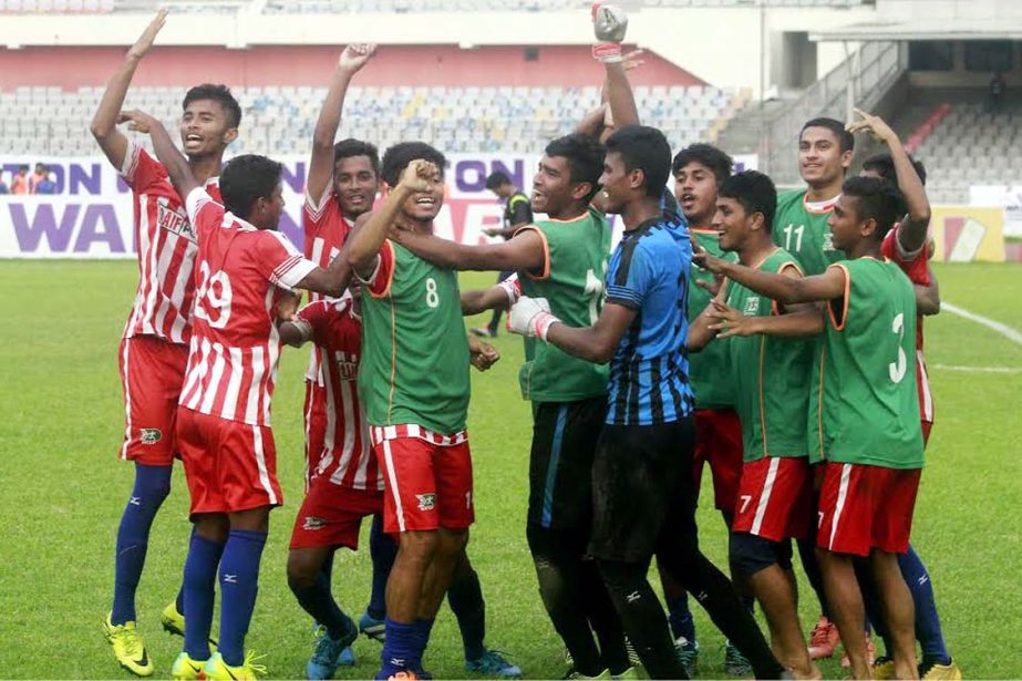 Players of BKSP Under-18 Football team celebrating after beating Sylhet Under-18 Football team by 4-3 goals in the tie-breaker of the first semi-final match of the Walton Under-18 National Football Championship at the Bangabandhu National Stadium on Sunda