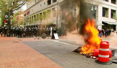 A fire set in downtown Portland during a May Day protest on Monday.
