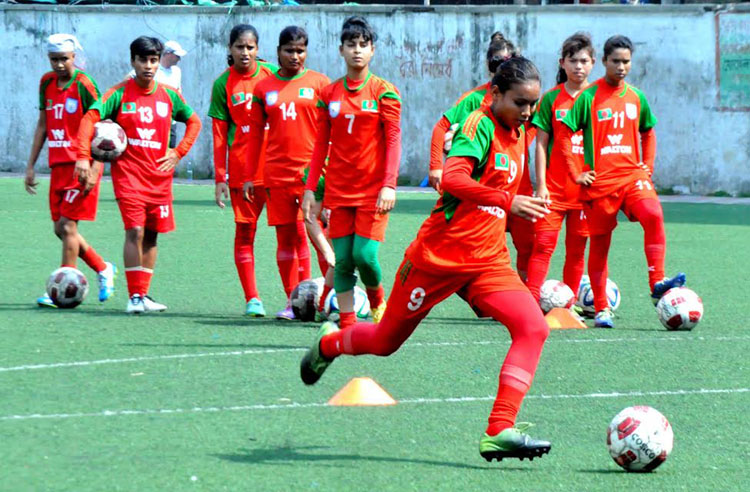 Members of Bangladesh Under-16 National Women's Football team during their practice session at the BFF Artificial Turf on Tuesday.