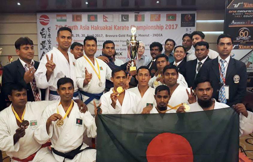 Members of Bangladesh Karate team, the champions of the 7th South Asia Hakukai Karate Championship pose for photograph at Mirat in India recently.