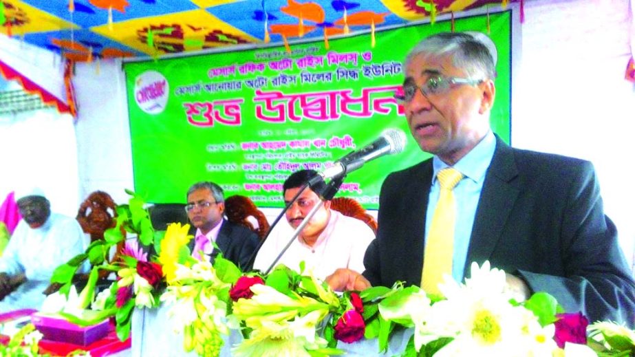 Ahmed Kamal Khan Chowdhury, Managing Director of Prime Bank, inaugurating the commercial operation of Anwar Auto Rice Mill (Unit-2) at Chapai Nawabganj on Wednesday. Abdul Wahed, Former President, Chamber of Commerce & Industries, Chapai Nawabgonj, Md. Ra