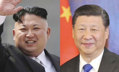 This combination of file photos shows North Korean leader Kim Jong Un, left, waving during a military parade to celebrate the 105th birth anniversary of Kim Il Sung in Pyongyang, North Korea, and Chinese President Xi Jinping, right, smiles during a meetin