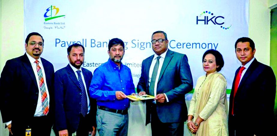 Md Khorshed Anowar, Head of Direct Business of Eastern Bank Ltd. and Rakibul Alam Chowdhury, Managing Director of HKC Group, exchanging documents after signing a Payroll Banking Agreement in Chittagong city recently. HKC Group is a leading RMG makers in t